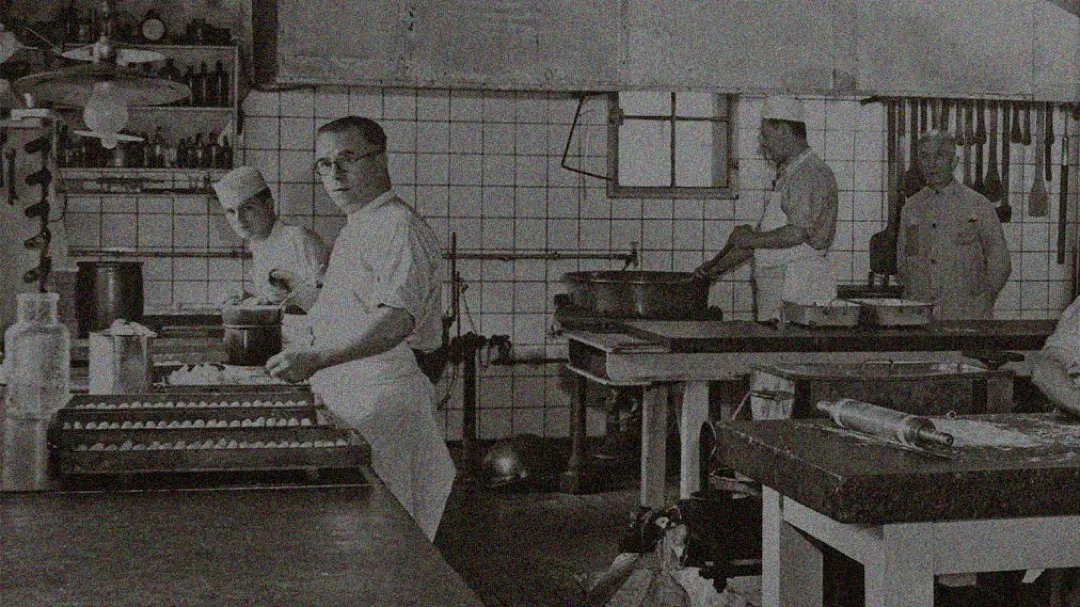 men making pralines in candy factory